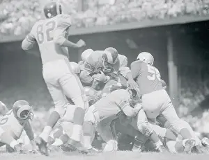 Goals Prints: Player Running Over Tacklers for a Touchdown