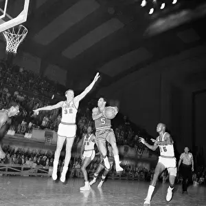 Player Shooting Ball in Basketball Game