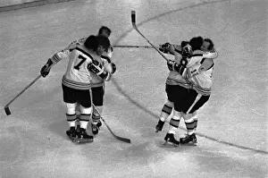 Players Celebrating on Ice After Win