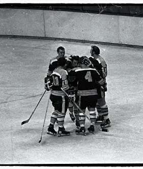 Players Embracing Bobby Orr on Ice
