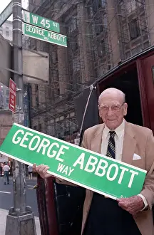Playwright George Abbott with Manhattan Street Sign