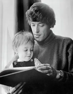 Playwright Tom Stoppard Holding Child