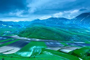 Plowed fields in the valley Monti Sibillini National Park, view from Castellucio di Norcia, Umbria, Italy
