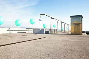 Images Dated 16th February 2018: Poetic picture of stop motion pictures in one of a line of green balloons flying in city corner with nice perspective