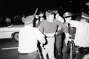 Police Arrest Demonstrator at Night