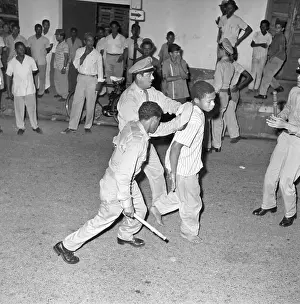 Police Take Away Barefooted Boy