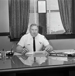 Brutality Prints: Police Chief Pritchett Sitting Behind Desk