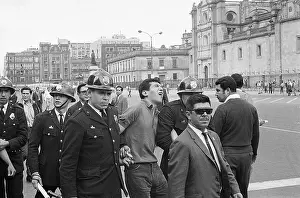 Police Escort Arrested Demonstrator