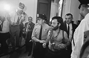 Police Escort Barechested Jerry Rubin