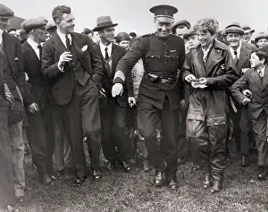 Prints of (Original Caption). When Lady Lindy Succeeded. Escorted by Ulster Police and surrounded by cheering crowds, Mrs The Sky's Trailblazer: Police Escorting Amelia Earhart