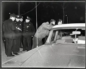 Gang Prints: Police With Fighting Youths; On Car