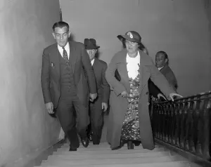 Stairway Prints: Police Hold Woman in Poisoning
