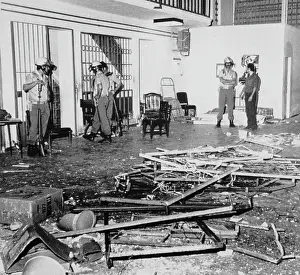 Police Observe Damage Caused by Demonstrating Prisoners