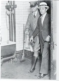Police Officer Escorting Matthew Capone