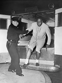 Police Officer Helping Charlie Parker from Ambulance