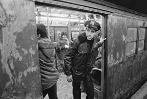 Passenger Prints: Police Officer Riding Subway Train