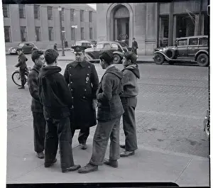Pavement Prints: Police Officer Talking to Group of Boys