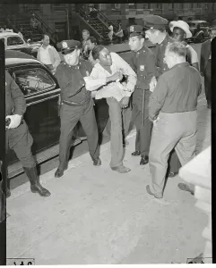 Rioter Prints: Police officers arrest man in Harlem Riots