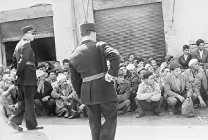 Police Questioning a Group of People