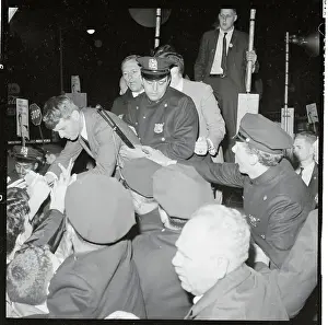 Police Standing Behind Robert F. Kennedy Shaking Hands