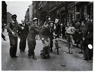 Police Tackle A Red Rioter;Raid On Commu