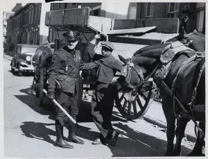 Arresting Prints: Policeman Arresting Black Striker