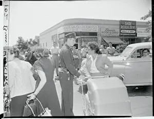 Policeman Confronting Women One on One