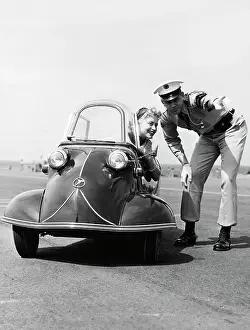 Frankfurt Prints: Policeman Directing Young Woman in Three-Wheel Car