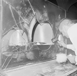 Policeman Dusting for Fingerprints