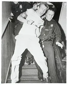 Policeman Escorting a Prisoner