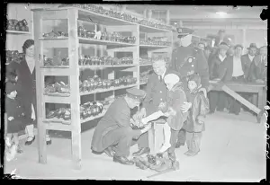 Policeman Fitting Child's Shoe