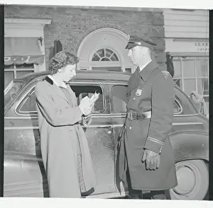 Policeman Being Interviewed by Poll Taker