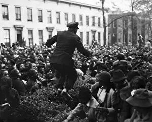 Policeman Jumping Across Crowd