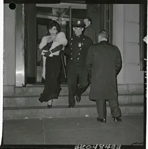 Policeman Leading a Man in Drag by the Arm