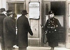 Policeman Beside Printed Warning