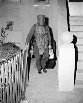 Protective Prints: Policeman in Protective Gear Carries Bombs