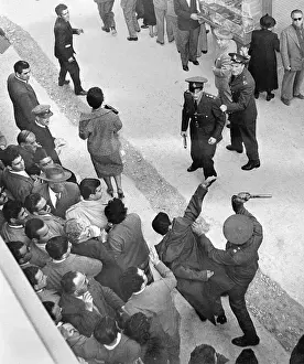 Athens Prints: Policeman Swinging His Club at a Rioter
