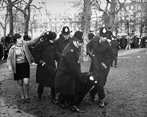 Policemen Carrying Injured Colleague