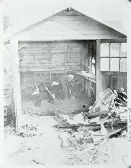 Policemen Digging in a Garage