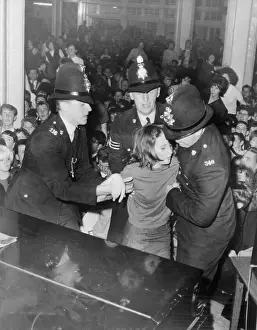 Manchester Prints: Policemen Helping a Fainting Beatles fan