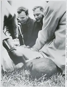 Policemen Pinning Down a Suspect