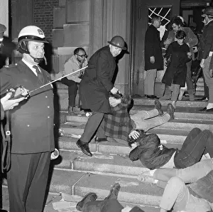 Policemen Remove Squatter