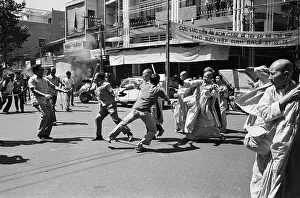 Monk Prints: Policemen Wield Clubs In Confrontation