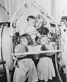 Polio Stricken Children Being Visited by Siblings