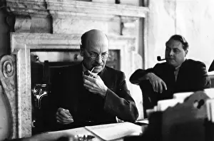 Prints of 27th July 1946: Prime Minister Clement Attlee, 1st Earl Attlee (1883 - 1967) studies a document while his Public Relations Adviser Francis Williams looks A Quiet Strength: A Leader Who Shaped Modern Britain: Political Smokers