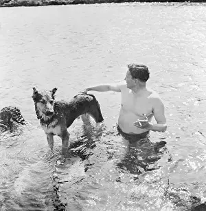 Politician Josip Broz Tito in Water With His Dog