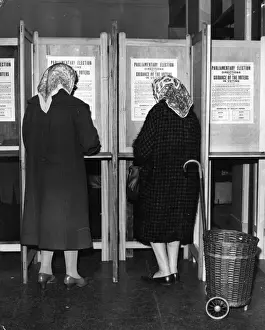 Prints of Two women voting in the polling booths at Lambeth Town Hall, for the British General Election. (Photo by Keystone/Getty Images) The Keystone Press Agency Collection Prints: Polling Day