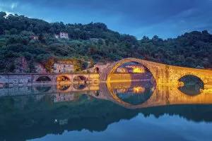 The Ponte della Maddalena in Tuscany at dusk
