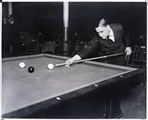 Pool Player Leaning Over To Take Shot