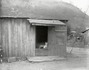 Poor Person Prints: Poor Boy in Doorway of Mill Worker's Shack